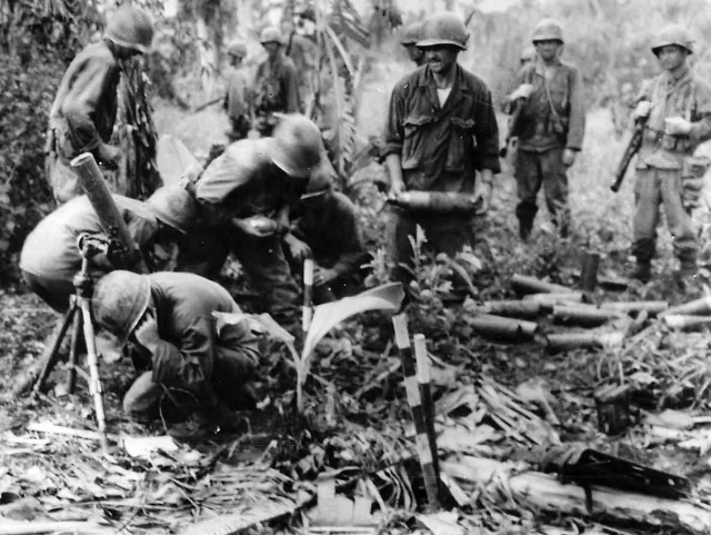 7th Infantry Division mortar squad in action on Leyte, Philippines. 