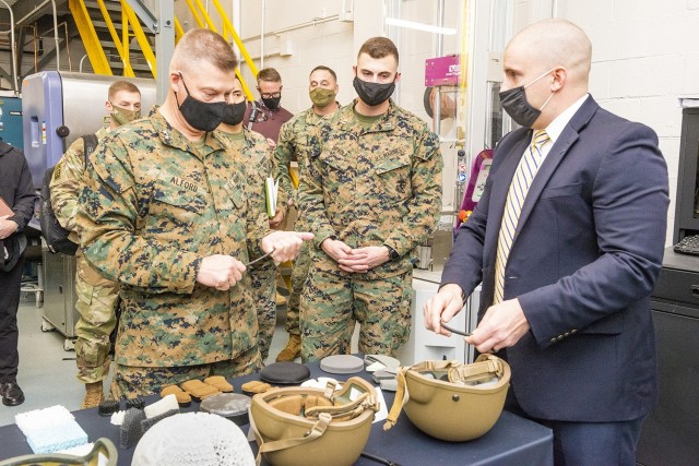 Maj. Gen. Julius &#34;Dale&#34; Alford, commanding general of U.S. Marine Corps Training Command, is briefed on helmet and headborne protection prototypes during a visit by U.S. Marine Corps personnel to the U.S. Army Combat Capabilities Development Command (DEVCOM) Soldier Center on December 8, 2021 in Natick, MA.