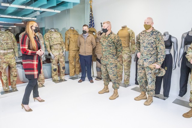 Maj. Gen. Julius &#34;Dale&#34; Alford, commanding general of U.S. Marine Corps Training Command, is briefed on uniform and equipment development in the Design Pattern Prototype Studio during a visit by U.S. Marine Corps personnel to the U.S. Army Combat Capabilities Development Command (DEVCOM) Soldier Center on December 8, 2021 in Natick, MA.