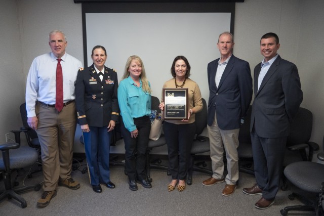 Daria Van Liew poses with colleagues after receiving the 2021 Headquarters Lt. Gen. Elvin “Vald” Heiberg, the third, Engineer of the Year Award, Nov. 12, 2021.