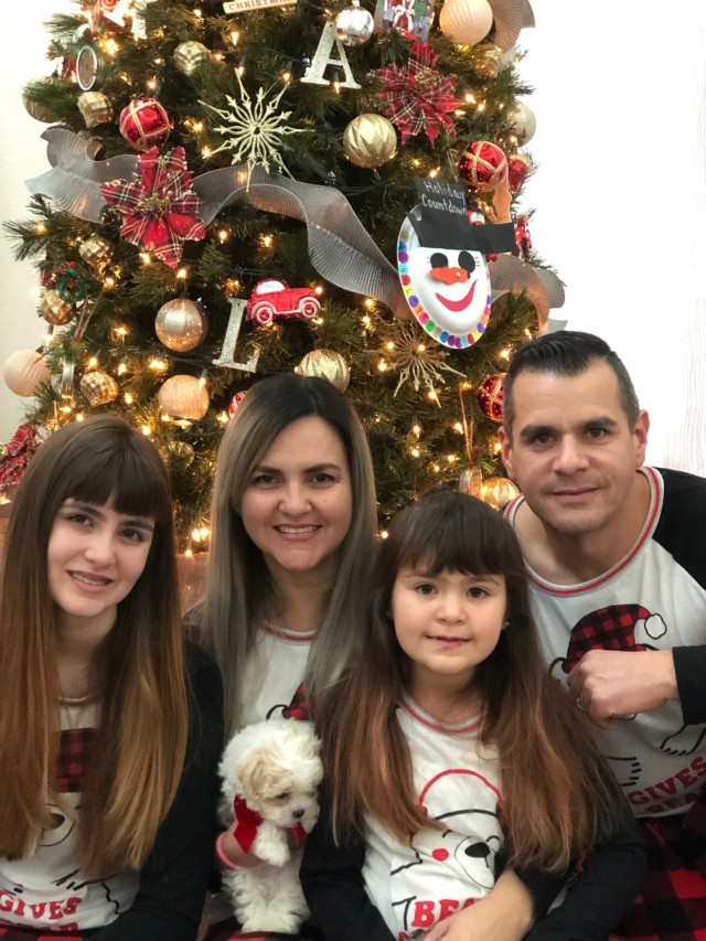 Master Sgt. Ruben Soto, the operations sergeant major for the 1397th Deployment and Distribution Support Battalion, poses with his family in a Christmas photo from years past. “I always tell my Soldiers, ‘thank my daughters that I have so much patience with you,’” Soto continued. “What I have learned with my daughters and my wife, it means everything.”