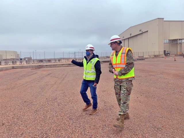 
Daniel de Robles, Area Engineer Tulsa District E&C Branch Tinker Air Force Base briefs USACE Chaplain Geoffrey Bailey during a visit to Tinker Air Force Base Dec. 23.  During the visit Bailey toured Tulsa District project on the base where he learned about the team’s mission. He also took time to meet the team and thank them for their hard work and professionalism as well as wish the staff a happy holidays.
