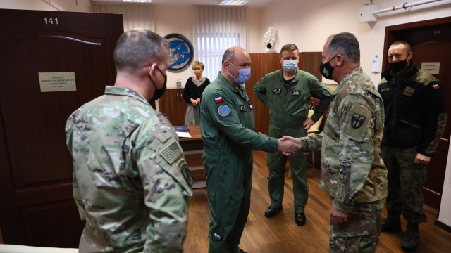 Maj. Gen. Jose J. Reyes meets with Brig. Gen. Wojciech Pikuła, commander of the Polish Air Force’s 3rd Airlift Wing, in his office at 33rd Air Transport Base near Forward Operating Site Powidz, Poland on Dec. 14. During their meeting they talked about readiness, troop conditions, current and future operations with the 191st Regional Support Group and ways to better enhance their overall mission in the region. The 191st RSG is conducting operations in 12 FOSs spread around the country, Lithuania and Latvia. The group, along with the 21st Theater Sustainment Command, U.S. Army Europe and Africa, and The U.S. European Command continues to enhance its interoperability with NATO alliance and partners in support of Atlantic Resolve funded by European Deterrence Initiative. (U.S. Army photo by Staff Sgt. Angel D. Martinez-Navedo)
