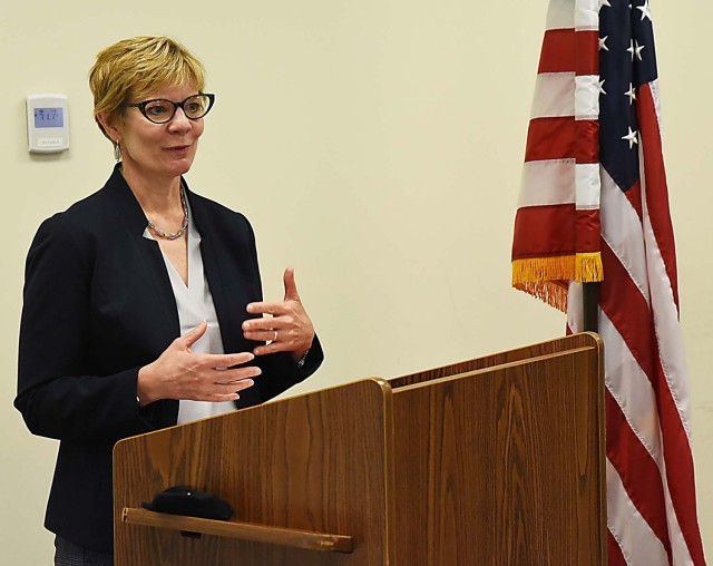 Carol Burton, Senior Executive Service, director, Civilian Human Resources Agency,  U.S. Army, Aberdeen Proving Grounds, Maryland, gives accolades to Joy Krush, a supervisory human resources specialist, Civilian Human Resources Agency, Midwest...
