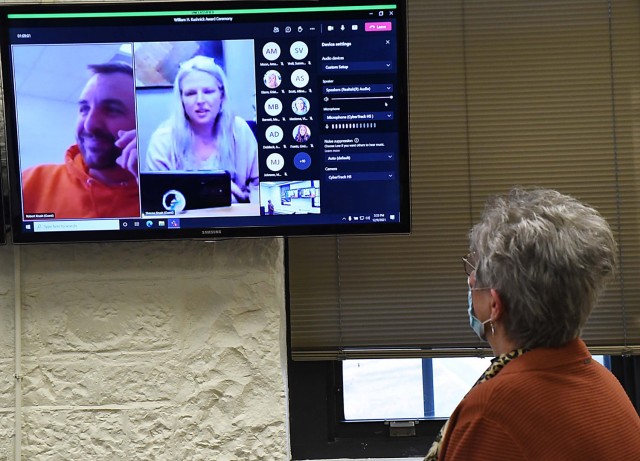 Joy Krush, a supervisory human resources specialist, Civilian Human Resources Agency, Midwest Region, Centralized Army Functions Division at Rock Island Arsenal, Illinois, looks at her son and daughter-in-law in a virtual ceremony here  Dec. 9, as...