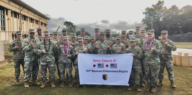 Soldiers from the 9th Mission Support Command's 303rd Maneuver Enhancement Brigade pose for a group photo during the commencement of Exercise Yama Sakura 81 at Schofield Barracks, HI. The Soldiers will serve as a subordinate unit for the...