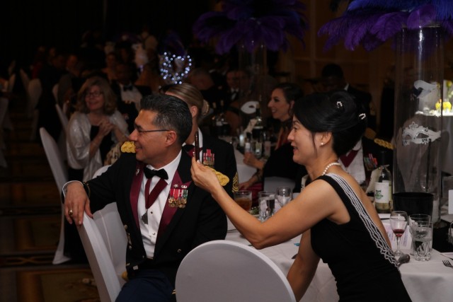 Photograph of Col. John Melton (left) and his wife Myung Hee Melton (right) at a formal event. (Photo Credit: Melton Family)