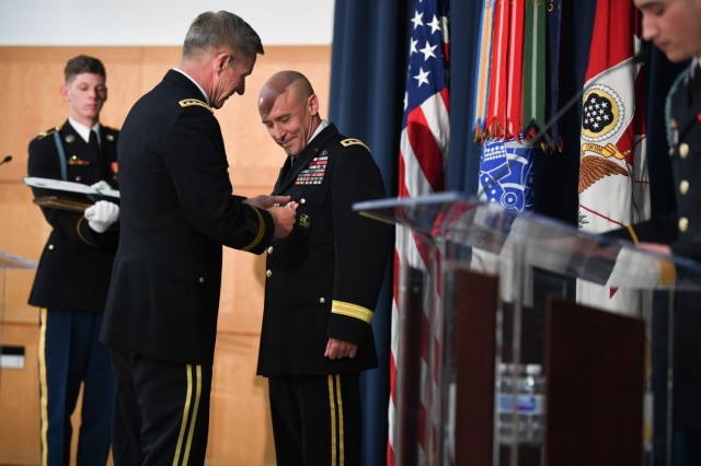 U.S. Army Gen. James C. McConville presents the Distinguished Service Medal to U.S. Army Lt. Gen. Thomas A. Horlander during a retirement ceremony at Lincoln Hall, Ft. McNair in Washington, D.C., June 23, 2021.
