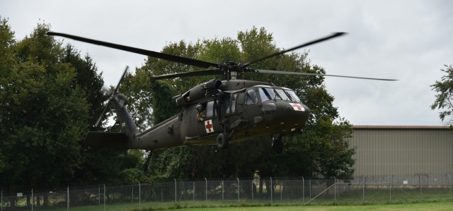 A Black Hawk helicopter lands at the Air Force Medical Readiness Agency grounds at Fort Detrick, Maryland, on September 21 for the purposes of testing the MEDHUB device. (Photo Credit: Gloriann Martin, USAMRDC Public Affairs)