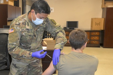 Indiana National Guard Spc. Christopher Santillan-Paiz administers a a COVID-19 vaccination to a 38th Infantry Division Soldier to maintain personal readiness and to bolster the National Guard's ability to respond to the nation’s needs, Saturday, Oct. 23, 2021. Photo by Sgt. 1st Class Ashley Lovett