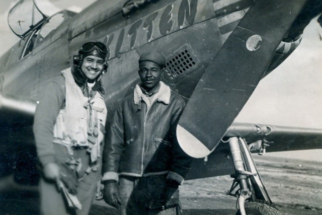 At Ramitelli airfield in Italy, Col. McGee stands in front of the P-51C he named &#34;Kitten&#34; for his wife. At his side is Nathaniel Wilson the Mustang&#39;s crew chief.