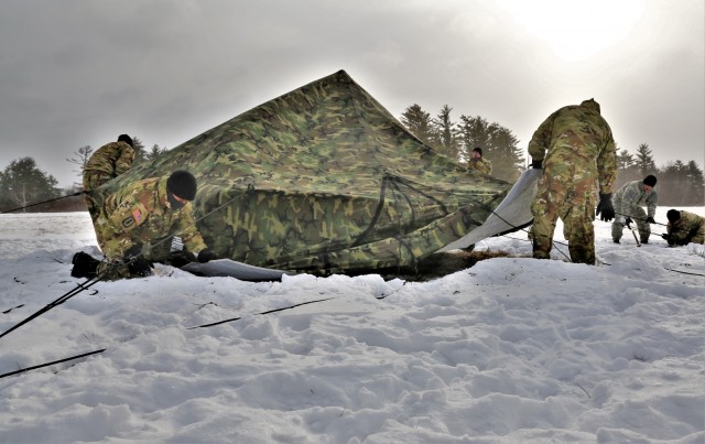 Soldiers learn to build Arctic tents during CWOC training at Fort McCoy