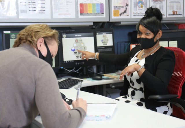 Lucinda Ward, right, an Army Community Service specialist, goes over Master Resilience Training course material with Terry Owens, an Army spouse, in Camp Zama, Japan, Jan. 27, 2022. ACS holds monthly MRT courses, in which students learn six...