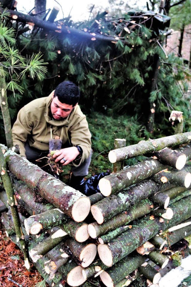 Building improvised shelters for Fort McCoy&#39;s Cold-Weather Operations Course
