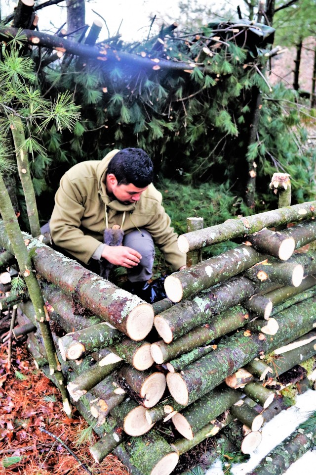 Building improvised shelters for Fort McCoy&#39;s Cold-Weather Operations Course