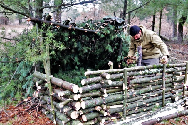 Building improvised shelters for Fort McCoy&#39;s Cold-Weather Operations Course
