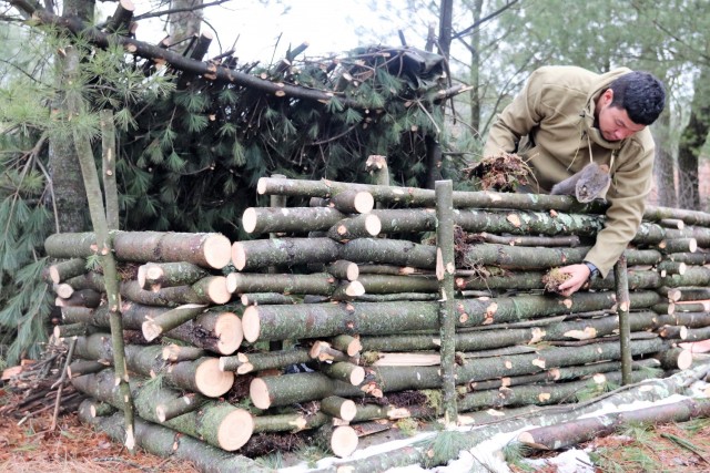 Building improvised shelters for Fort McCoy&#39;s Cold-Weather Operations Course