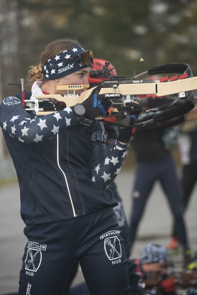 Spc. Deedra Irwin, a human resources specialist with 86th Troop Command, 86th Infantry Brigade Combat Team (Mountain), Vermont Army National Guard, fires a biathlon rifle during practice at the Camp Ethan Allen Training Site in Jericho, Vermont,...
