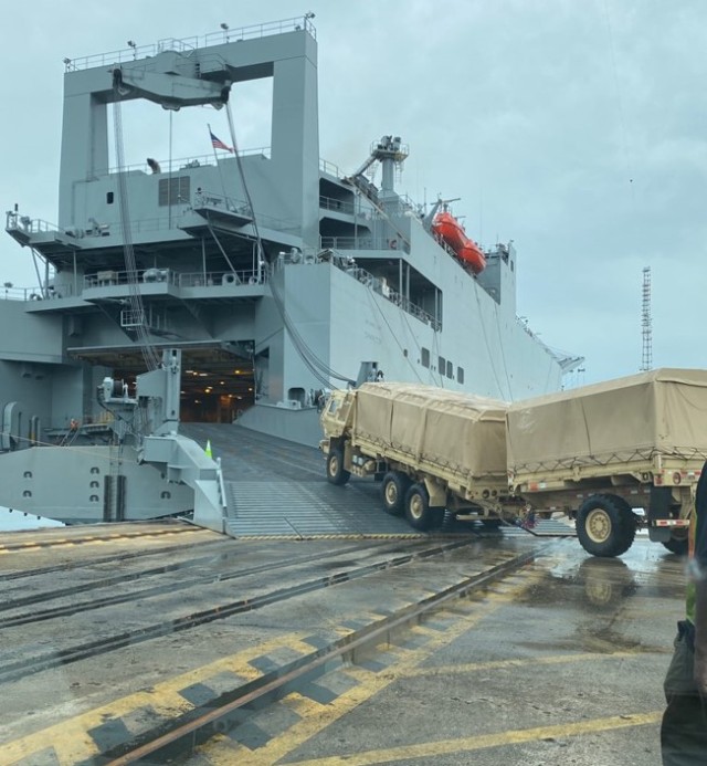 A Medium Tactical Vehicle (MTV), M1085 with trailer is loaded onto a Large, Medium - Speed Roll-on/Roll-off vessel at Wharf Alpha, Charleston, South Carolina, in preparation for future operations. The Army Field Support Battalion – Charleston, is responsible for the readiness and employment of critical power projection capability. 