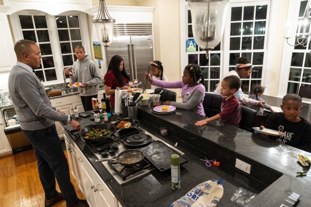 Benjamin Spencer, dean of the William & Mary Law School and a U.S. Army Reserve captain, cooks dinner for his family of nine children at home in Williamsburg, Virginia, Dec. 3, 2020. Spencer does most of the cooking in the evening for his family even after a long day of work. Spencer is the first African-American dean hired by the oldest law school in the country and a U.S. Army Reserve officer and lawyer who works for the Government Appellate Division. Spencer graduated from Harvard Law School and joined the Army when he was almost 41 because he felt a calling to serve people and serve his nation. (U.S. Army Reserve photo by Master Sgt. Michel Sauret)