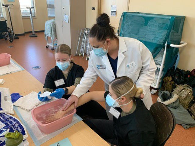 Wisconsin National Guard troops train on proper hand-washing techniques at Madison College in Madison, Wis., Jan. 20, 2022. The Wisconsin National Guard partnered with Madison College to train approximately 200 troops to assist health care...