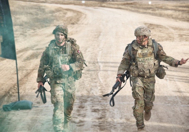 Maj. Bryan Ahlborn and Sgt. 1st Class David McAfee, Regional Health Command, were the first team to cross the finish line during the last event of the 2022 Army Best Medic Competition. 

Ahlborn and McAfee finished first after finishing in third place in 2021. 