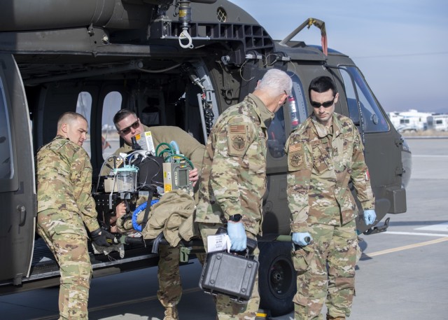 Members from the 124th Medical Group’s Critical Care Air Transport Team participate in a medical evacuation exercise during their unit training assembly Feb. 5, 2022, at Gowen Field Air National Guard Base, Idaho. The exercise tested the...