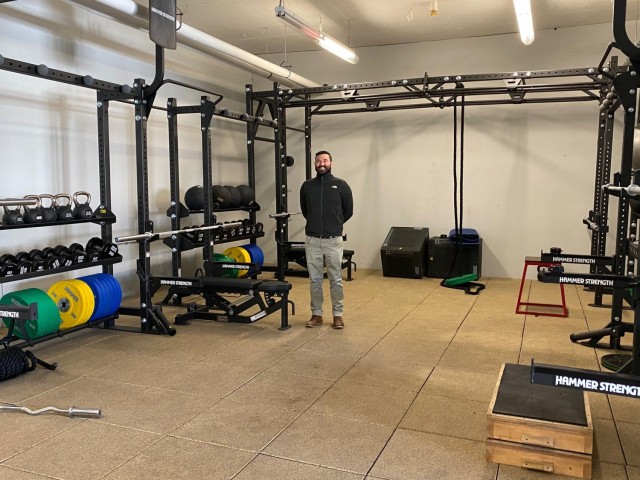 Bert Scott, Supervisory Recreation Specialist at the CPT James Burt Fitness Center located on Natick Soldier Systems Center, Natick, Mass shows the upgrades of the gym that have happened over the last couple years. (Photo by Vannessa Josey, Natick Public Affairs)