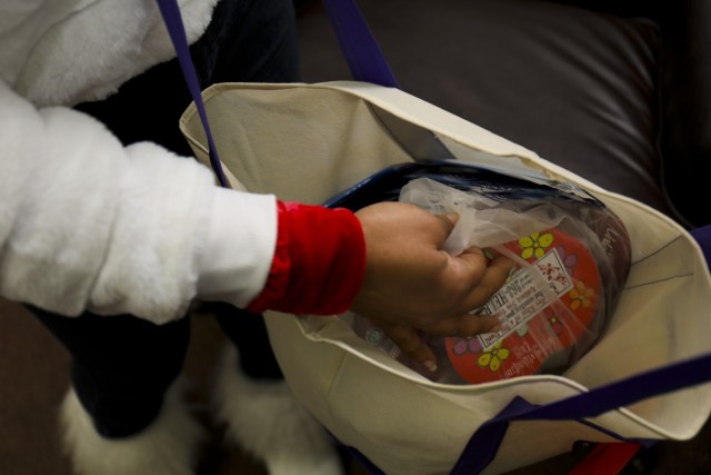 Lucinda Ward, an Army Community Service specialist, prepares to hand out candies to staff at U.S. Army Garrison Japan as part of Operation Good Cheer at Camp Zama, Japan, Feb. 11, 2022.