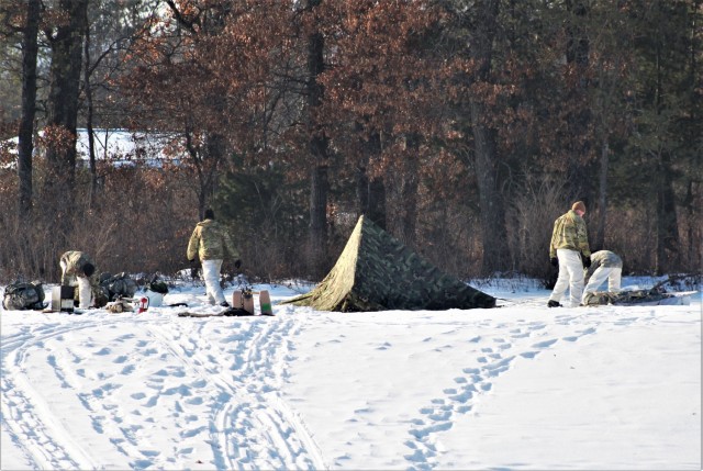 Cold-Weather Operations Course class 22-03 students build Arctic tents on Fort McCoy&#39;s South Post