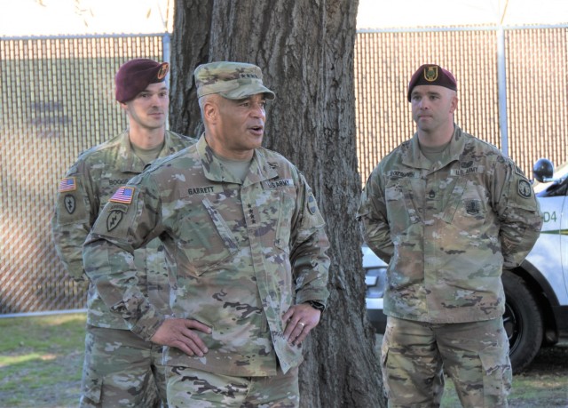 General Michael Garrett, FORSCOM commander, addresses Soldiers at a special ceremony honoring their exemplary dedication to readiness during Fiscal Year 2021. Cpt. Larry Boggs, 550th commander, and Sgt. 1st Class Christopher Bozovich, Kennel Master, listen in as Garrett expressed his pride in the unit. 