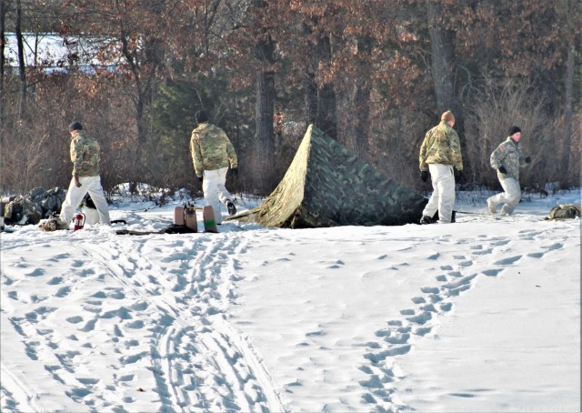 Cold-Weather Operations Course class 22-03 students build Arctic tents on Fort McCoy&#39;s South Post