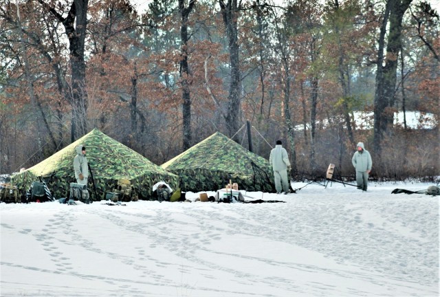 Cold-Weather Operations Course class 22-03 students build Arctic tents on Fort McCoy&#39;s South Post
