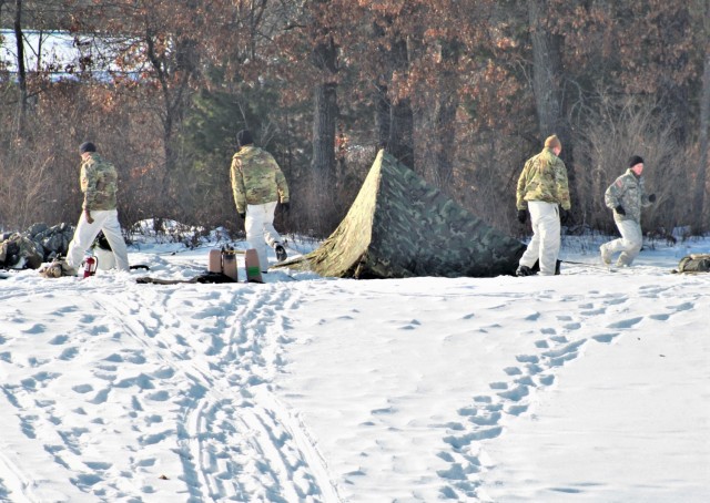 Cold-Weather Operations Course class 22-03 students build Arctic tents on Fort McCoy&#39;s South Post