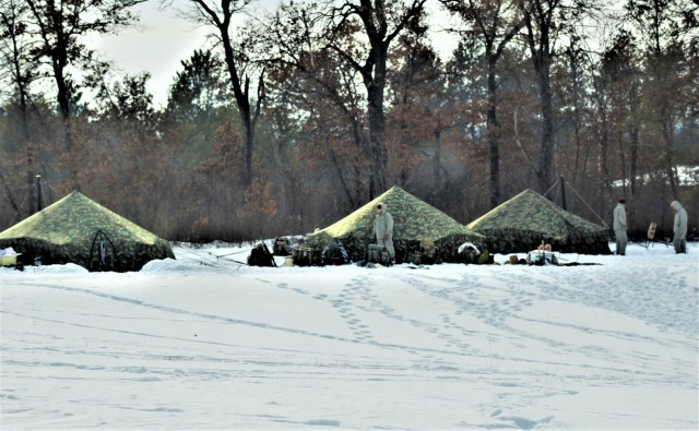 Cold-Weather Operations Course class 22-03 students build Arctic tents on Fort McCoy&#39;s South Post