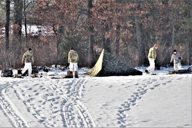 Cold-Weather Operations Course class 22-03 students build Arctic tents on Fort McCoy&#39;s South Post