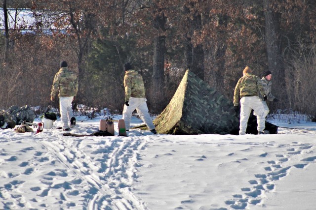 Cold-Weather Operations Course class 22-03 students build Arctic tents on Fort McCoy&#39;s South Post