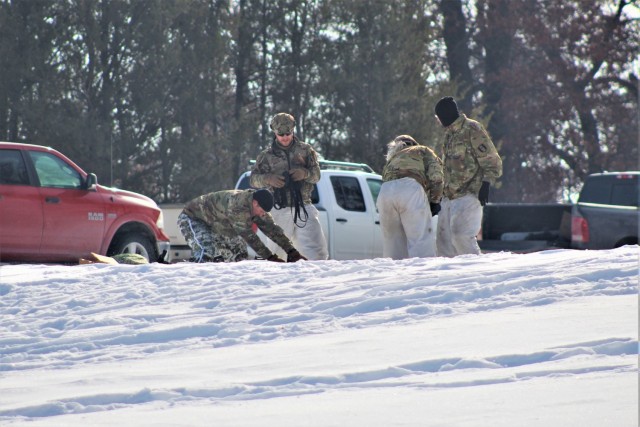 Cold-Weather Operations Course class 22-03 students build Arctic tents on Fort McCoy&#39;s South Post