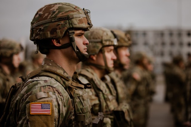 U.S. Army National Guard Soldiers assigned to 3rd Battalion, 161st Infantry Regiment stand in formation during a handover, take over ceremony at Bemowo Piskie Training Area, Poland, Feb. 11, 2022. The ceremony demonstrated NATO&#39;s continued commitment to the collective defense and security of our allies on NATO&#39;s eastern flank. (U.S. Army photo by Sgt. 1st Class Adrian Patoka)
