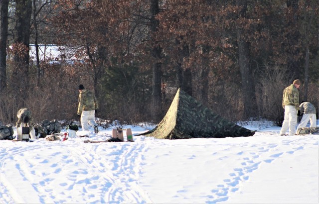 Cold-Weather Operations Course class 22-03 students build Arctic tents on Fort McCoy&#39;s South Post