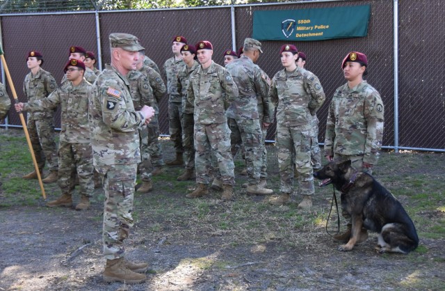Command Sgt. Maj. Todd Sims, FORSCOM CSM, checks out the Military Working Dogs of the 550th, as General Michael Garrett, FORSCOM commander, engages Soldiers standing in formation. 