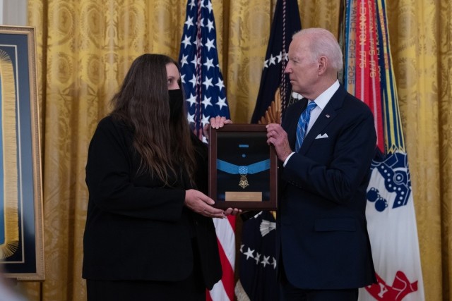 President Joe Biden presents the Medal of Honor to Tamara Cashe, the spouse of Sgt. 1st Class Alwyn Cashe, during a ceremony at the White House on Dec. 16, 2021. Cashe was posthumously awarded the Medal of Honor for actions of valor during Operation Iraqi Freedom while serving as a platoon sergeant with Alpha Company, 1st Battalion, 15th Infantry Regiment, 3rd Infantry Division, in Salah Ad Din province, Iraq, on Oct. 17, 2005. 