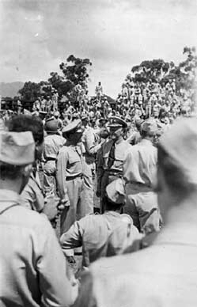 In May, 1944, the 7th Infantry Division paraded before the Commander of all U.S. Forces in the Central Pacific, Navy Admiral Chester C. Nimitz.  