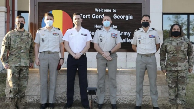 Army Cyber Center of Excellence (CCOE) and Fort Gordon commander Brig. Gen. Paul T. Stanton (left) and CCOE Command Sgt. Maj. Delia Quintero (right) pose for a photo with Brig. Gen. Philippe de Montenon, deputy commander of the French Cyber Command (second from left) and his colleagues during a combined meeting at Fort Gordon, Ga., Feb. 11, 2022. The meeting advanced a long-standing French-U.S. cyber partnership and improvied both forces' interoperability and capacity. (U.S. Army photo)