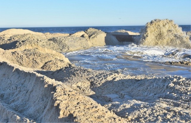 Coastal storm splits an island and brings communities together