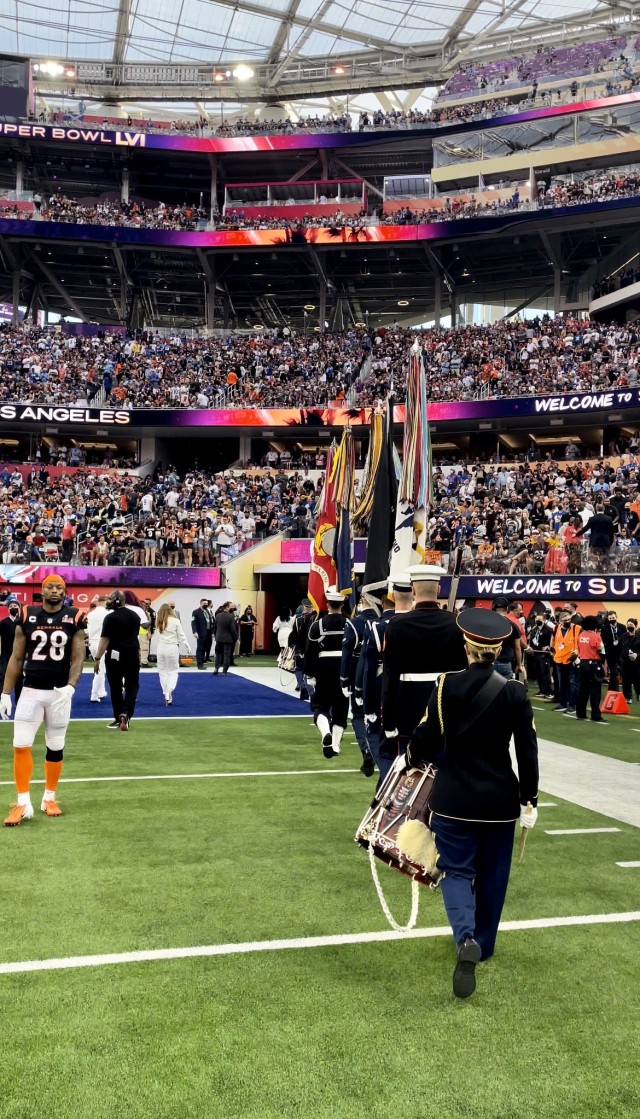 A Joint Armed Forces Color Guard and drummers from The U.S. Army Band present the colors during the national anthem at Super Bowl LVI. Each of the eleven service members from the National Capital Region were selected by their service honor guard to represent the Department of Defense at the game.