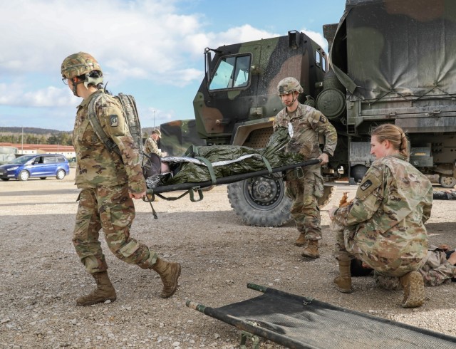 Soldiers of the 547th Medical Company (Area Support), 62nd Medical Brigade, react to a mock accident during a mass casualty training event at the Joint Multinational Readiness Center in Hohenfels, Germany, Feb. 17, 2022. The medical company is in...