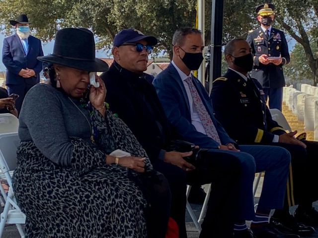 Angela Holder, the grand-niece of Cpl. Jesse Moore, wipes away tears during an interpretative marker unveiling ceremony, held at the Fort Sam Houston National Cemetery, San Antonio, Texas, Feb. 22, 2022. The ceremony recognized the Soldiers of the 24th Infantry Regiment, who were involved in the Houston Riot of 1917, with an interpretative marker explaining the history of the regiment and those who died. (U.S. Army Photo by Bethany Huff)