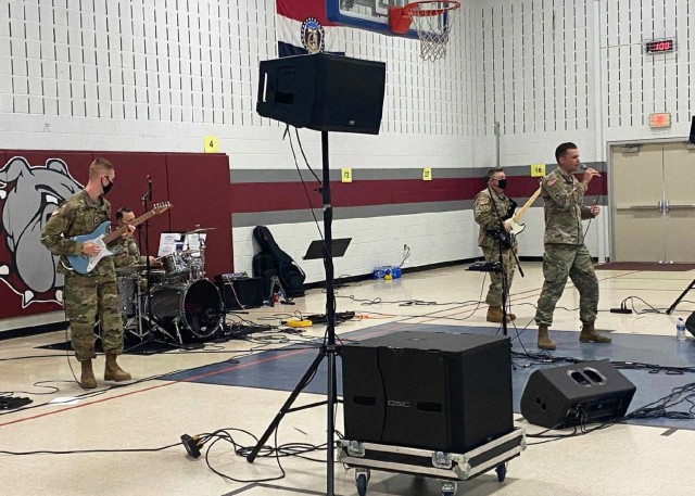The 399th Army Band's Rough Riders rock band performs at Rolla Middle School, in Rolla, Missouri, in 2021. Five ensemble groups — including the Rough Riders — from Fort Leonard Wood's 399th Army Band are scheduled to perform for students in local area schools throughout March , as part of the nationwide Music in Our Schools Month observance.  Started by the National Association for Music Education in 1985, the program raises awareness each March, about the importance of providing high-quality music education for all children. 