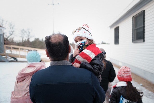 The last family of Afghan guests is shown departing Fort McCoy, Wis., on Feb. 15, 2022, to end the Operation Allies Welcome mission at the post. The Department of Defense, through U.S. Northern Command, and in support of the Department of Homeland Security, is providing transportation, temporary housing, medical screening, and general support for at least 50,000 Afghan guests at suitable facilities, in permanent or temporary structures, as quickly as possible. This initiative provides Afghan guests essential support at secure locations outside Afghanistan. (U.S. Army photo by Sgt. Robert P Wormley III, 50th Public Affairs Detachment)